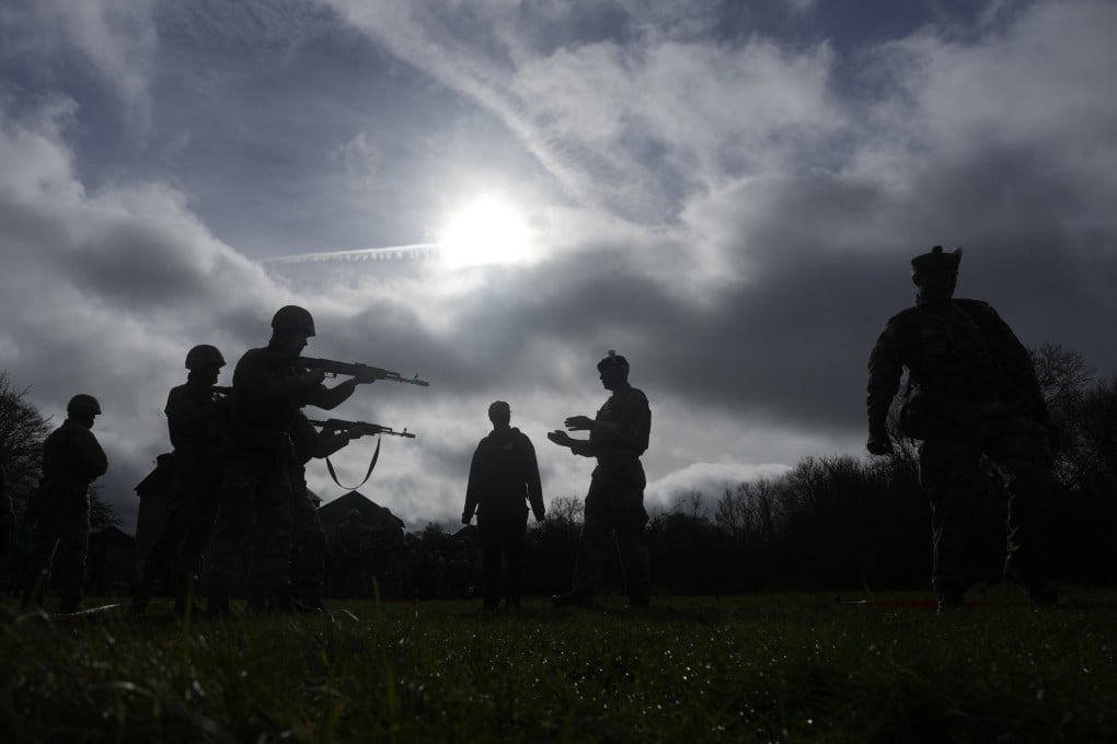 Ukrainian recruits train under British soldiers train at an army camp in England in February 2024. Photo: AP