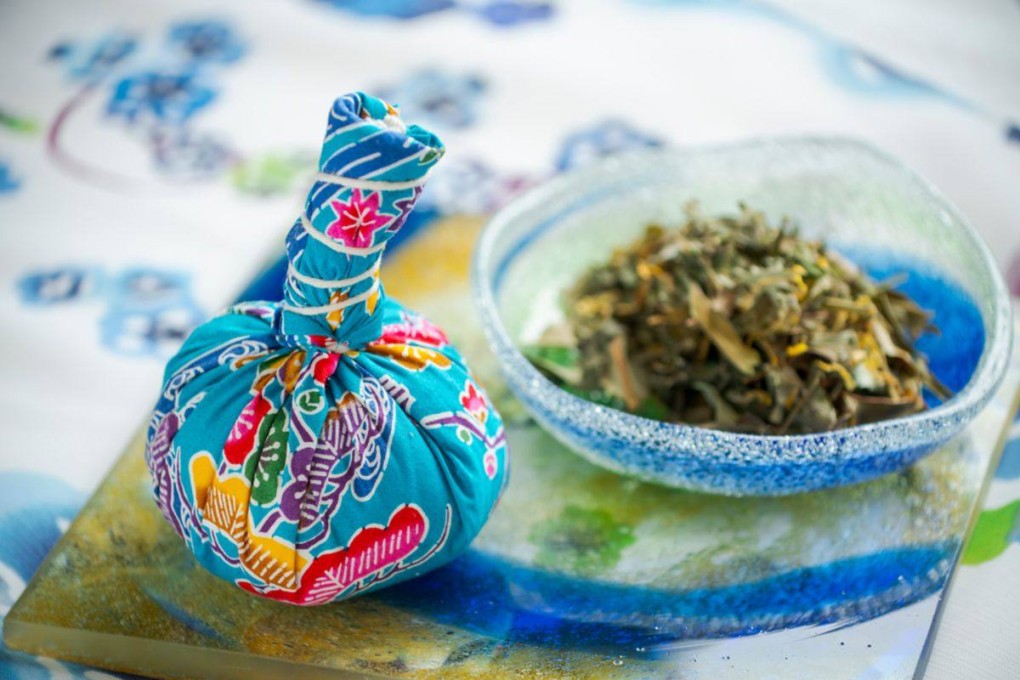 A compress with dried mugwort leaves is applied to the head, shoulders and neck during a soothing massage at the Ritz-Carlton in Okinawa, Japan. Photo: ritzcarlton.com
