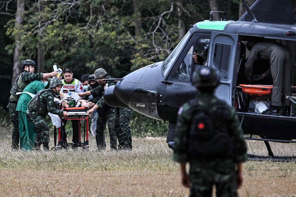An injured person taken to a military helicopter during clashes along the Thai-Cambodian border in Thailand’s Surin province on Wednesday. Photo: AFP