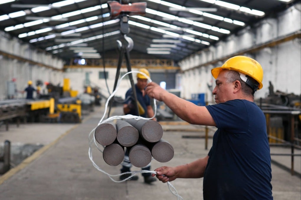 Employees work at a steel bar factory in Santa Catarina, Nuevo Leon state, Mexico, in November. Photo: AFP