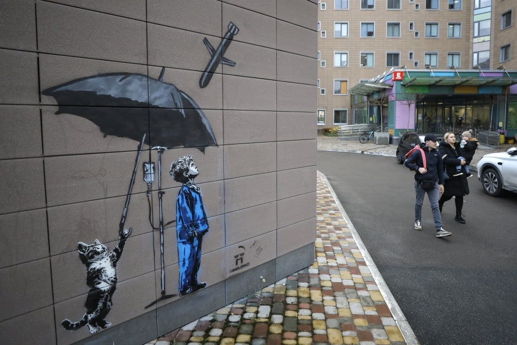 A cat protects a boy from a Russian missile with an umbrella, in a mural by Ukrainian artist Andriy Yarmolenko, seen by on Wednesday at a children’s hospital in Kyiv. Photo: EPA