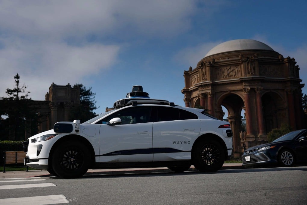 A Waymo robotaxi drives by the Palace of Fine Arts in San Francisco on Monday. Photo: AFP