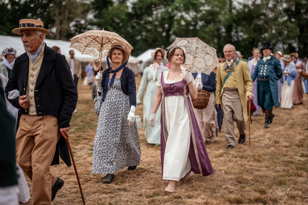 People dressed in period costume attend the Jane Austen Regency Country Fair, on July 6, in Steventon, Hampshire. Photo: Getty Images