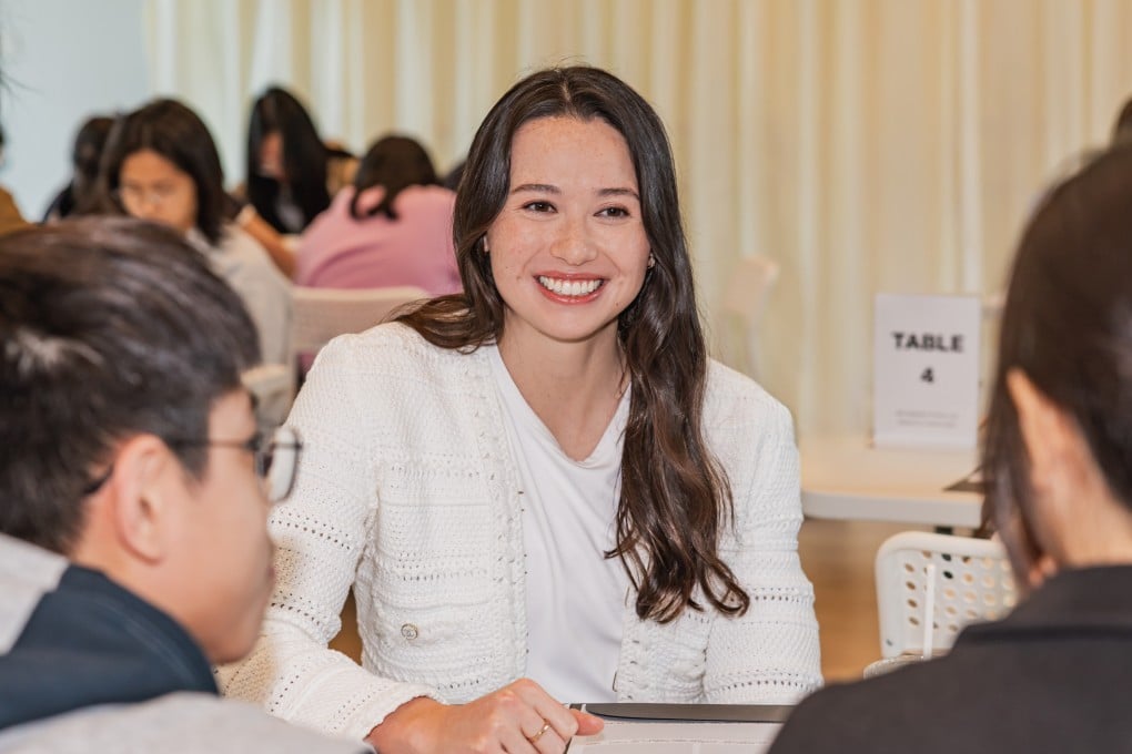 Hong Kong Olympian swimmer Siobhan Haughey chats with students at the “Empower through Reading” talk on December 7. Photo: Chanel