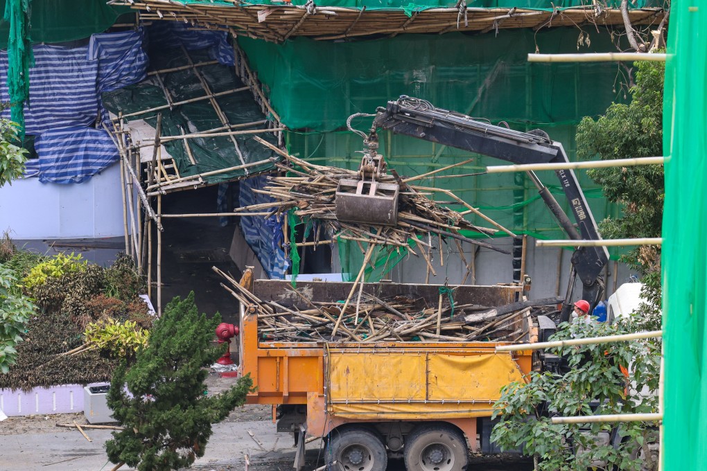 Damaged bamboo scaffolding is removed from the scene of the fire at Wang Fuk Court in Tai Po. Photo: Jelly Tse