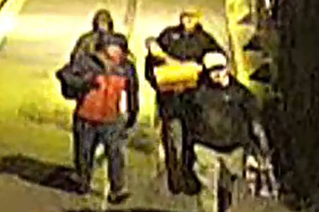 This image of CCTV footage shows men carrying bags outside a building which housed items from the Bristol Museum’s British Empire and Commonwealth collection. Photo: Avon and Somerset Police via AFP