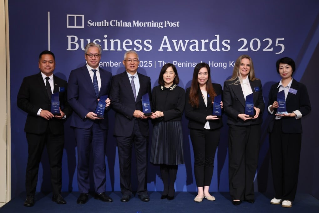 The winners of the 2025 SCMP Live Business Awards. (From left) Jerry Tam on behalf of Xpeng founder He Xiaopeng, Prudential Hong Kong CEO Lawrence Lam, McDonald’s Hong Kong chairman Zhang Yichen and CEO Randy Lai, Telefield Medical Imaging’s Yen Law, BioZein’s Anna Rayton and APT Electronics’ Winnie Chan during the awards ceremony on Friday. Photo: SCMP
