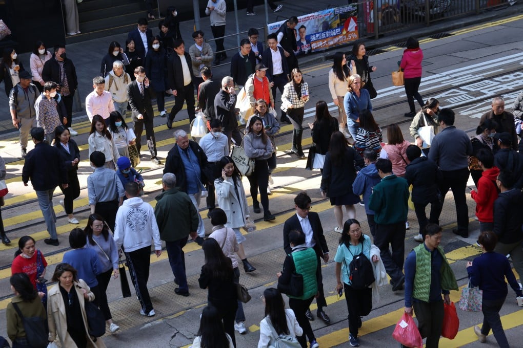 People cross a road in Central during lunch hour on January 6. Photo: Jelly Tse