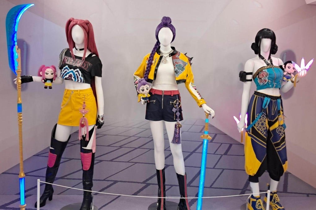 Life-size mannequins display the signature costumes of the girl group Huntrix at a KPop Demon Hunters pop-up in Seoul. Photo: The Korea Times