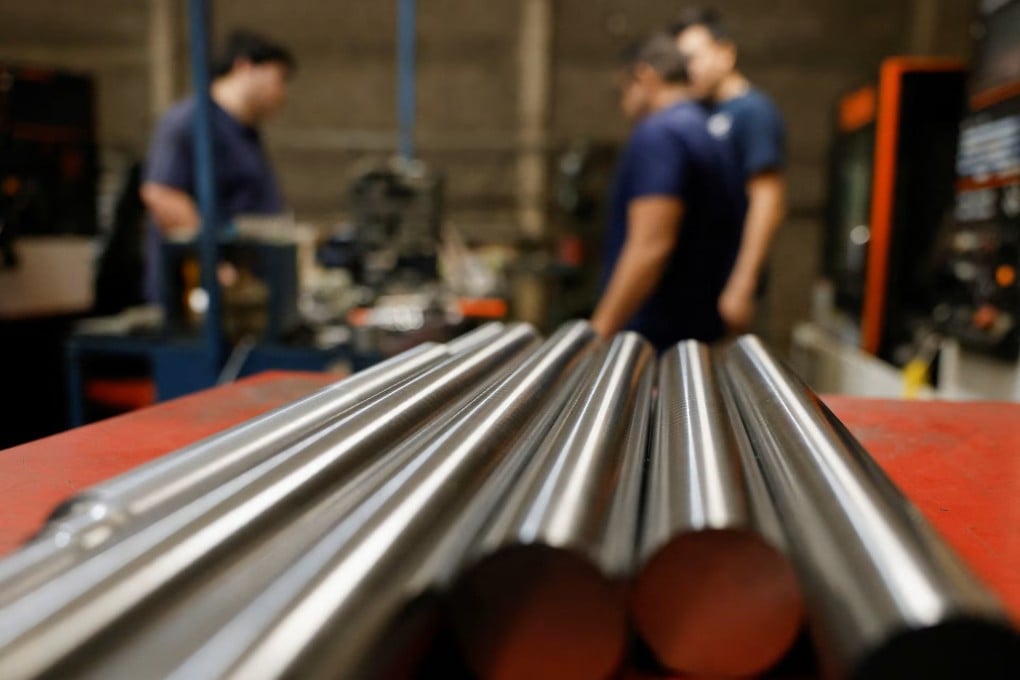 Workers at a metal-mechanical parts factory in Apodaca, Mexico. Photo: Reuters