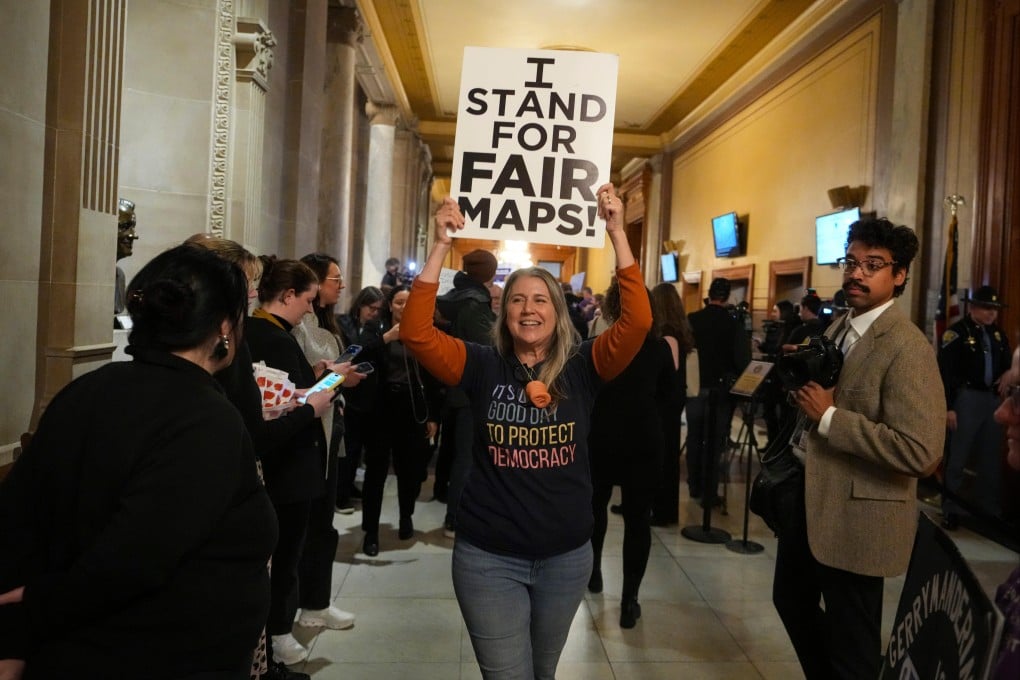 A protester celebrates outside the Indiana Senate Chamber on Thursday. Photo: AP