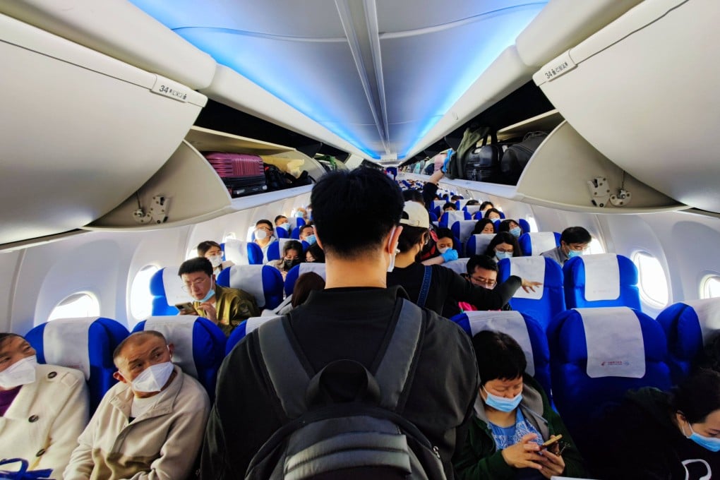 Passengers board a flight at an airport in Beijing. China’s major airlines are facing criticism for charging extra seat selection fees. Photo: Getty Images