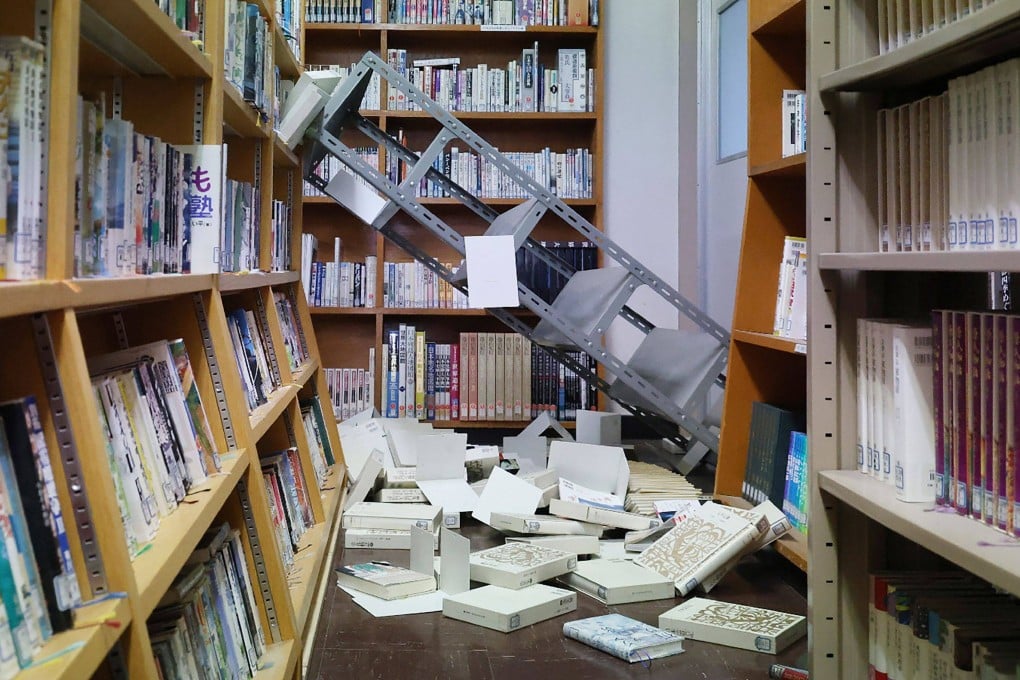 Collapsed bookshelves at a high school library in Hachinohe City in Aomori prefecture on Tuesday following a 7.5 magnitude earthquake off northern Japan. Photo: JIJI Press/AFP