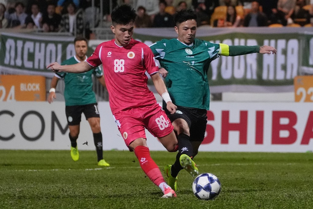 Tai Po’s Philip Chan (right) fights for the ball with Le Van Do at Mong Kok Stadium. Photo: Elson Li