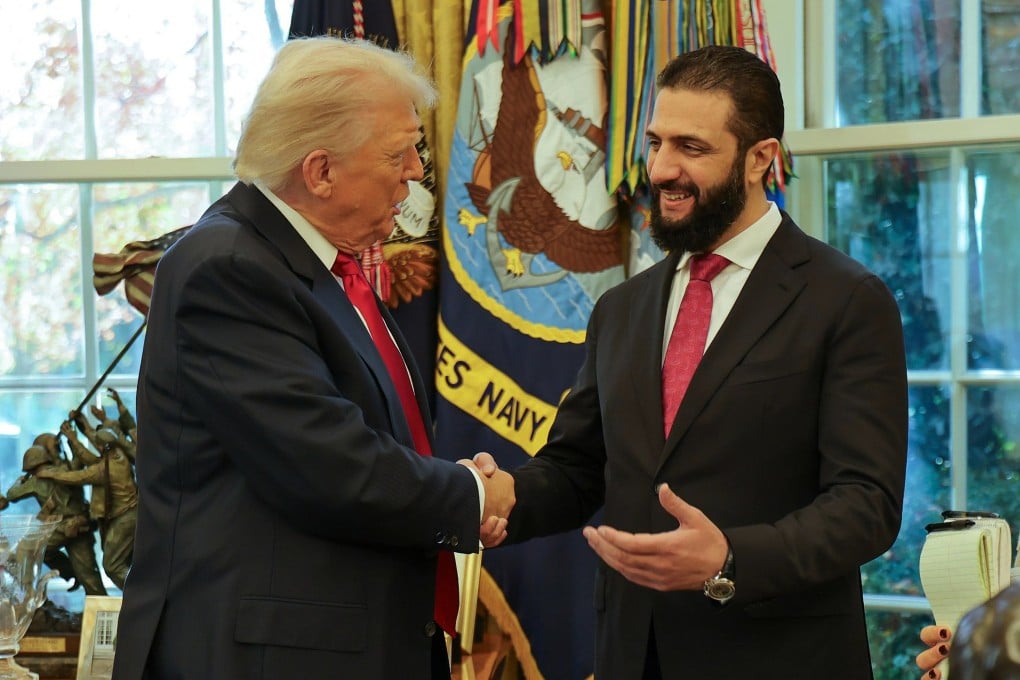 US President Donald Trump (left) shakes hands with Syria’s President Ahmad al-Sharaa at the White House in Washington last month. Photo: AP