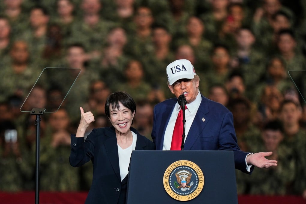 Japanese Prime Minister Sanae Takaichi gestures as US President Donald Trump delivers a speech during their visit to the aircraft carrier USS George Washington in Yokosuka, Japan, on October 28. Photo: AP