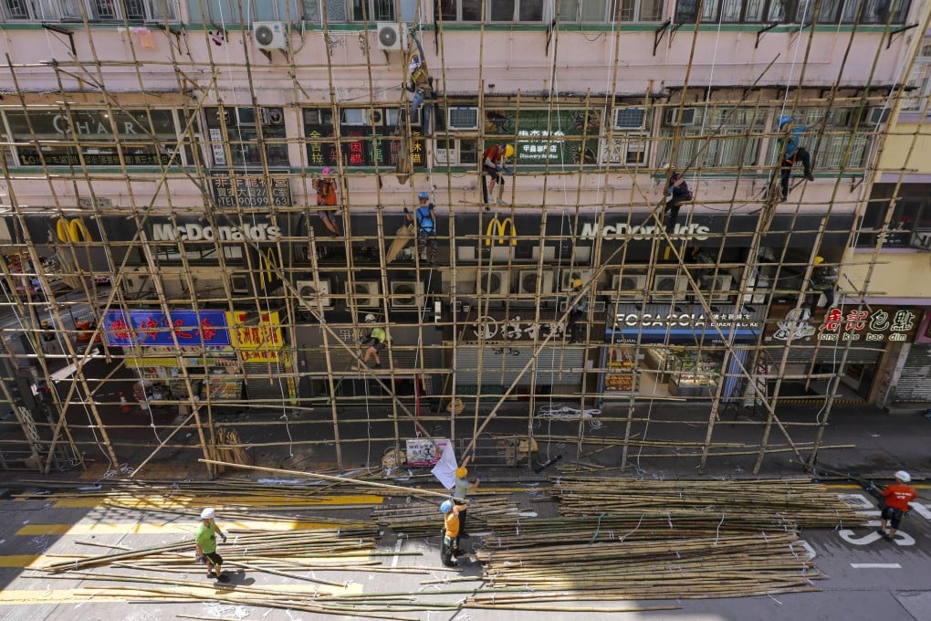 Workers carry out emergency repair works outside Po On Building in Mong Kok on July 5, 2023, after concrete chunks fell off the building for a second time in three days. Photo: Jelly Tse