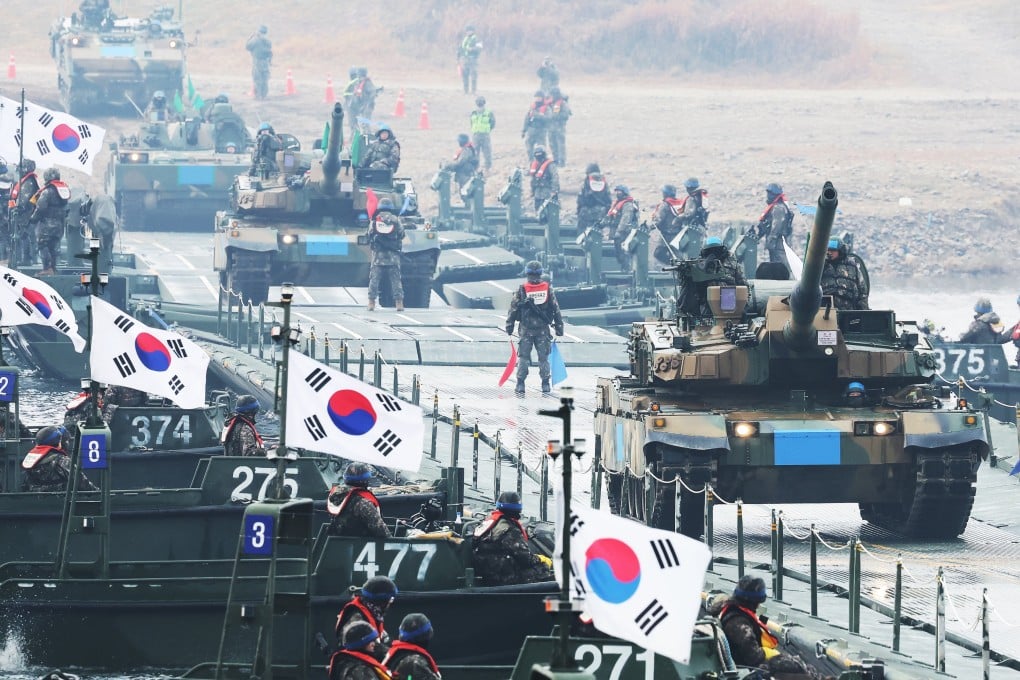 South Korean tanks cross a pontoon bridge over the Namhan River during a river crossing exercise in Yeoju on November 25. Photo: EPA