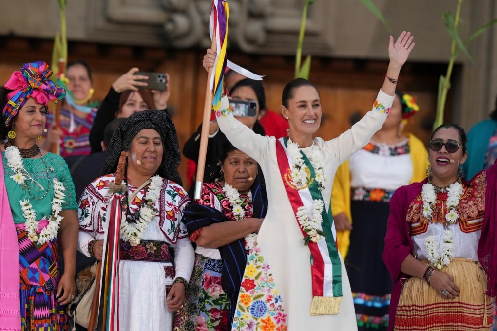 Mexican President Claudia Sheinbaum waves to supporters in the Zocalo main square on her inauguration day. Photo: AP