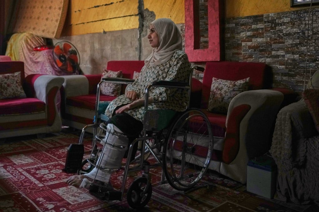 Haneen al-Mabhouh,  who lost her leg in an Israeli strike on her home, sits in a wheelchair in her family home in Nuseirat, central Gaza Strip, on November 6. Photo: AP