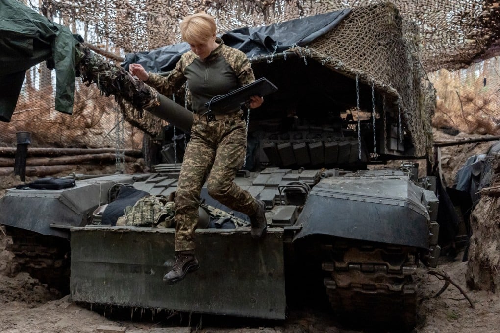 A Ukrainian soldier jumps down from a tank in Kharkiv, Ukraine, last month. Photo: AP