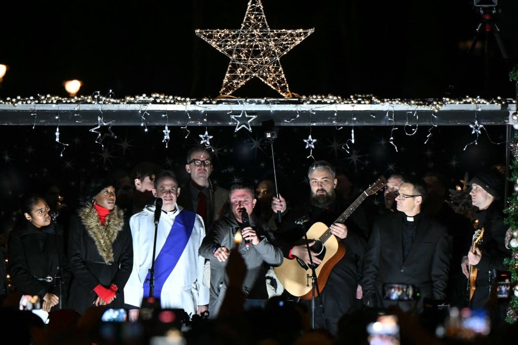 British far-right activist Tommy Robinson addresses supporters in central London on Saturday. Photo: AFP