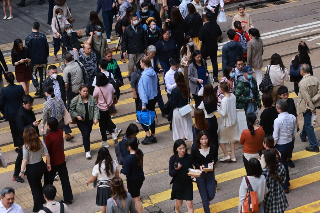 Pedestrians cross a road in Central, Hong Kong. Photo: May Tse