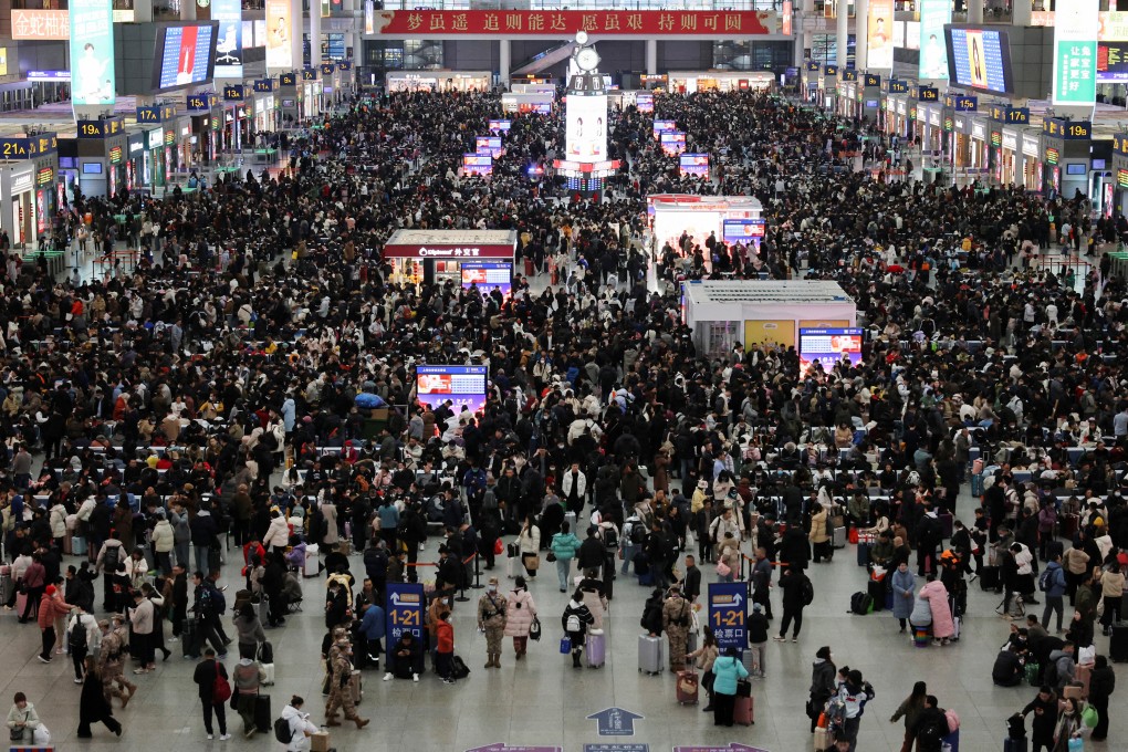 People wait for their train at the packed departure hall in Shanghai Hongqiao Railway Station. Photo: Reuters