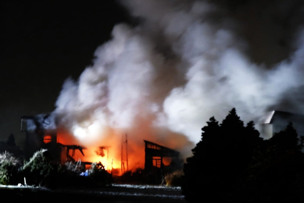 A house burns after a powerful earthquake hit Aomori, northeastern Japan, early on Tuesday last week. Photo: Jiji Press/EPA