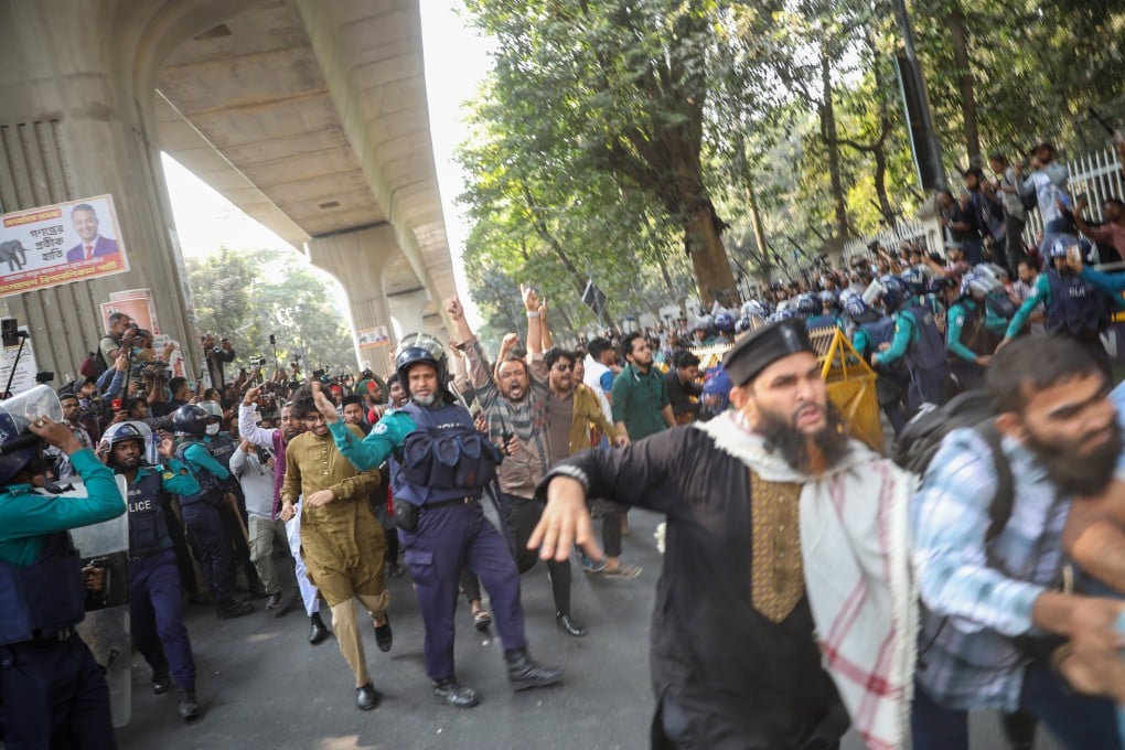 Members of the Dhaka University Central Students’ Union march in Dhaka in Bangladesh on Sunday, demanding the arrest of attackers who shot student leader Sharif Osman Hadi. Photo: EPA