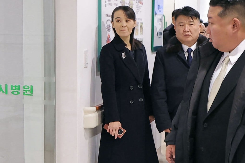 Kim Yo-jong is seen holding a suspected Chinese phone in this picture taken on Saturday showing leader Kim Jong-un (right) inspecting a new hospital Kusong. Photo: KCNA/KNS/AFP