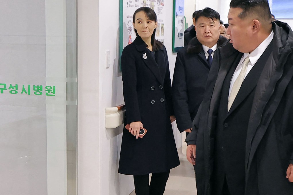 Kim Yo-jong is seen holding a suspected Chinese phone in this picture taken on Saturday showing leader Kim Jong-un (right) inspecting a new hospital Kusong. Photo: KCNA/KNS/AFP