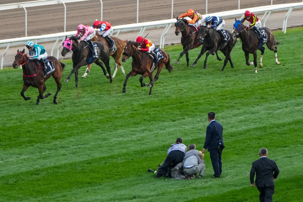 The track invader is held still while the Group One Hong Kong Cup field approaches at Sha Tin on Sunday. Photo: Sam Tsang