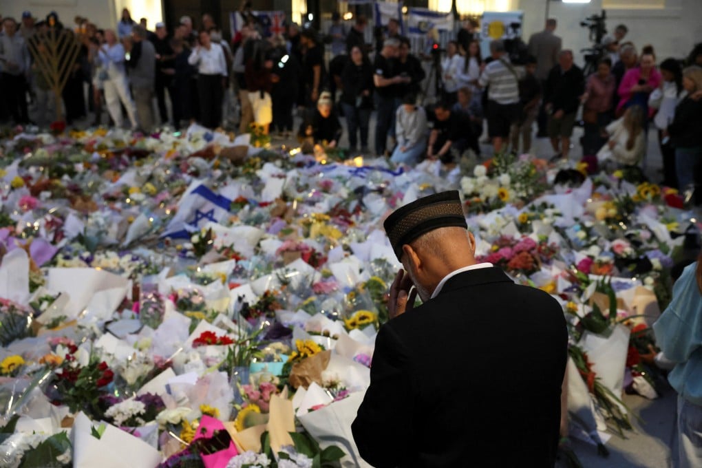 People pay their respects near Bondi Beach on Monday to the victims of Sunday’s shooting. Photo: Reuters
