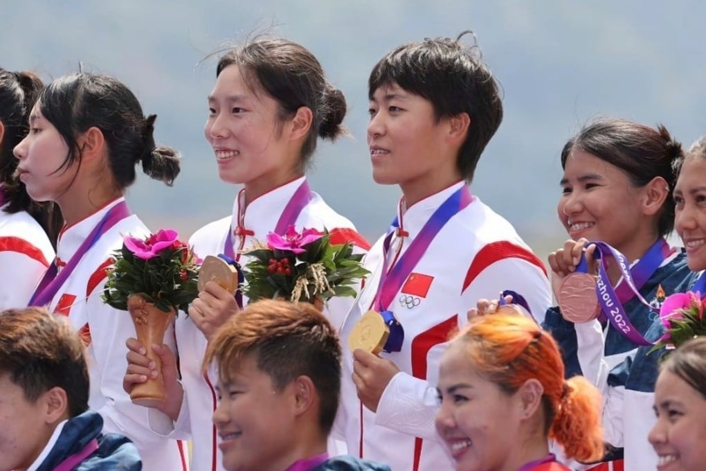 China’s Wang Li (centre, with short hair) receives one of the three gold medals she won at the Asian Games in Hangzhou in 2023. Photo: SCMP