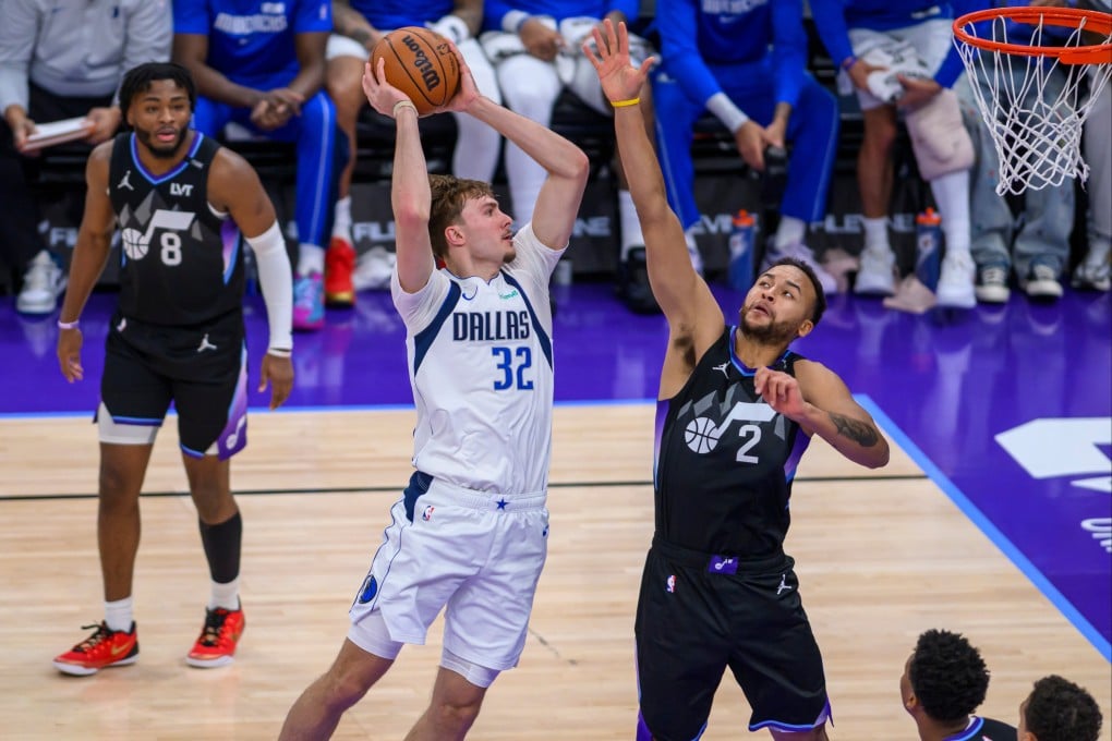 Dallas Mavericks forward Cooper Flagg (middle) drives to the basket guarded by Utah Jazz forward Kyle Anderson during the first half of their NBA match on Monday in Salt Lake City. Photo: AP