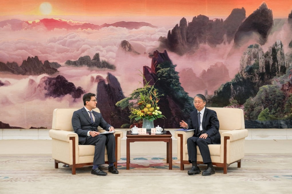 Shen Chunyao, director of the Hong Kong Basic Law Committee and chairman of the Legislative Affairs Commission (right) speaks with Jose-Antonio Maurellet, chairman of the Hong Kong Bar Association during his visit to Beijing. Photo: Handout