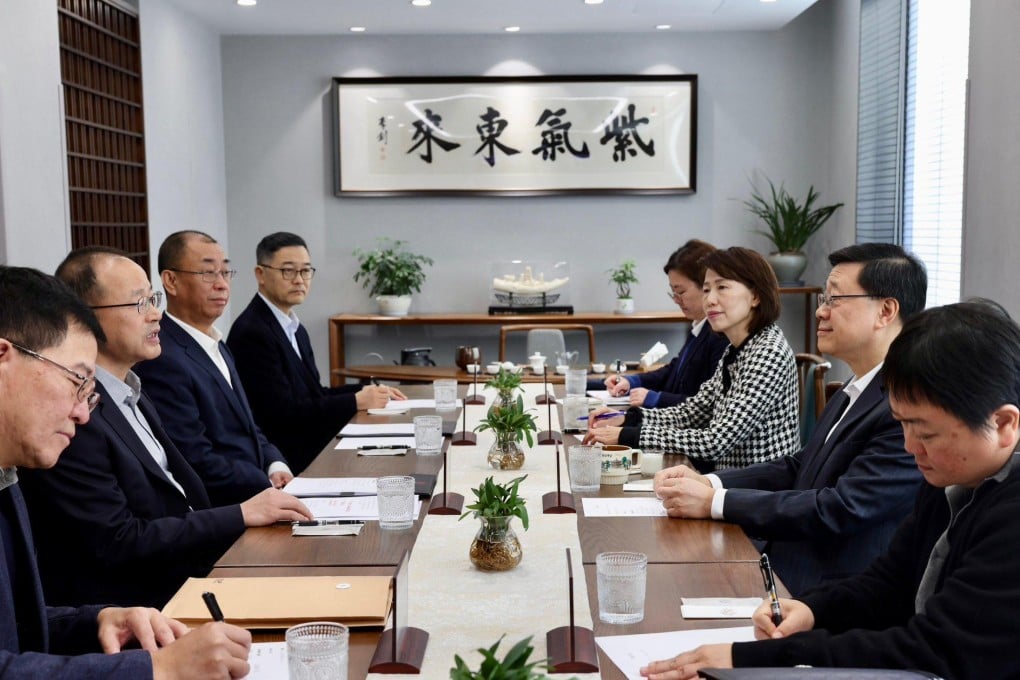 Chief Executive John Lee (second from right) meets with Peking University’s party secretary He Guangcai (second from left) on Wednesday. Photo: Facebook