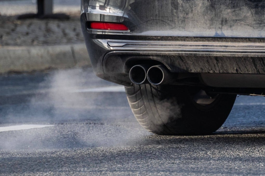 Fumes emerge from the exhaust pipe of a car with a combustible engine in Berlin. Photo: AFP