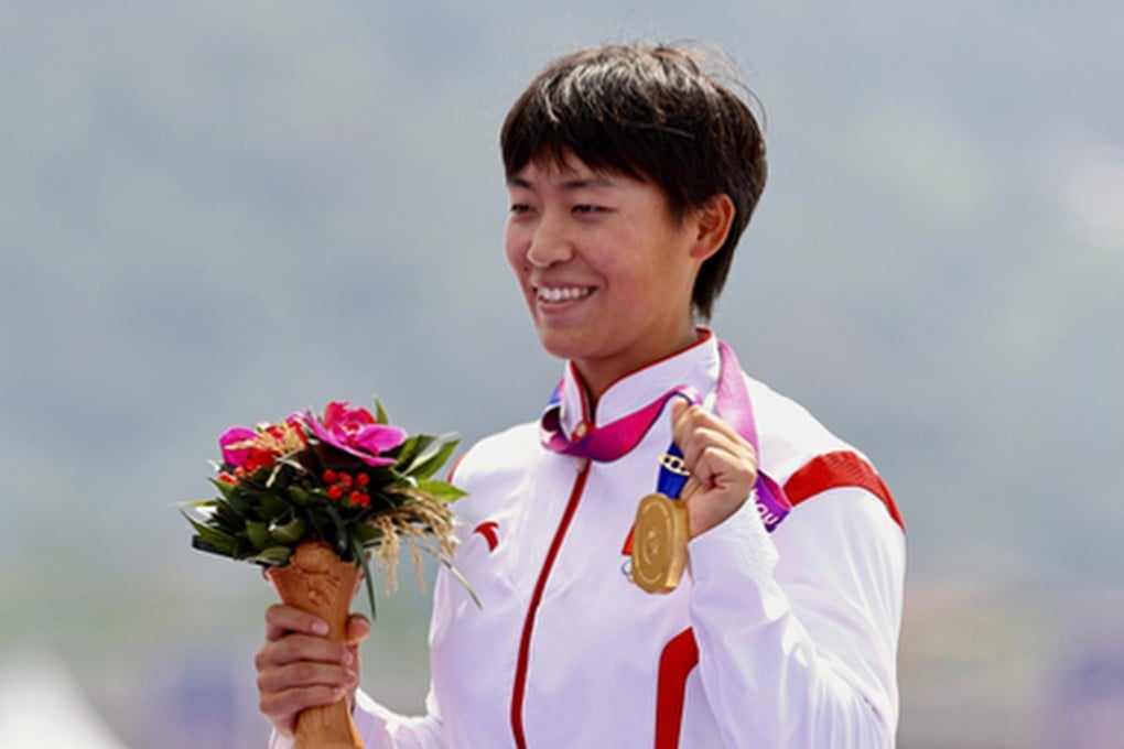 China’s Wang Li receives one of the three gold medals she won at the Asian Games in Hangzhou in 2023. Photo: SCMP