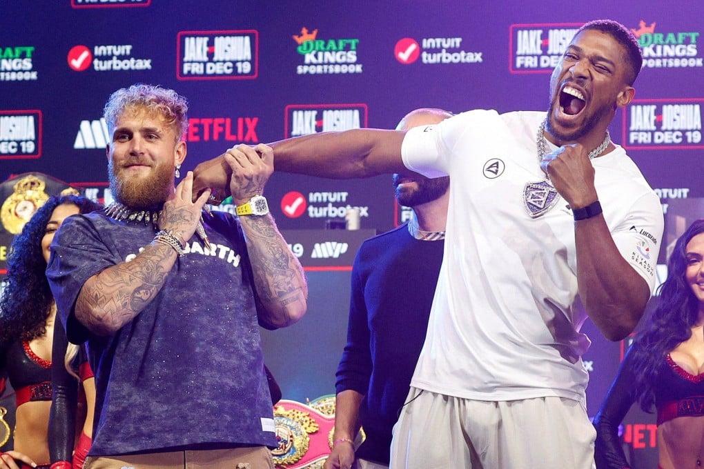 Jake Paul (left) and Anthony Joshua clown around during their press conference in Miami on Wednesday. Photo: Reuters