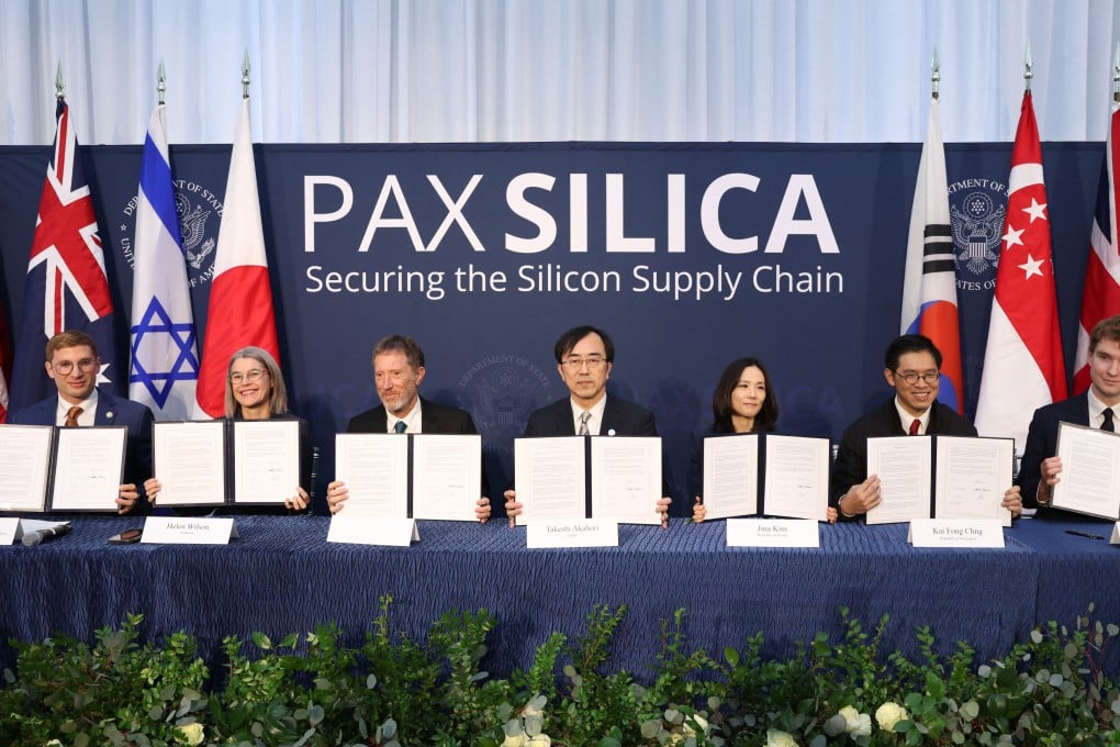 Representatives of the “Pax Silica” signatories hold signed documents at a summit held in Washington on December 12. Photo: Getty Images/AFP