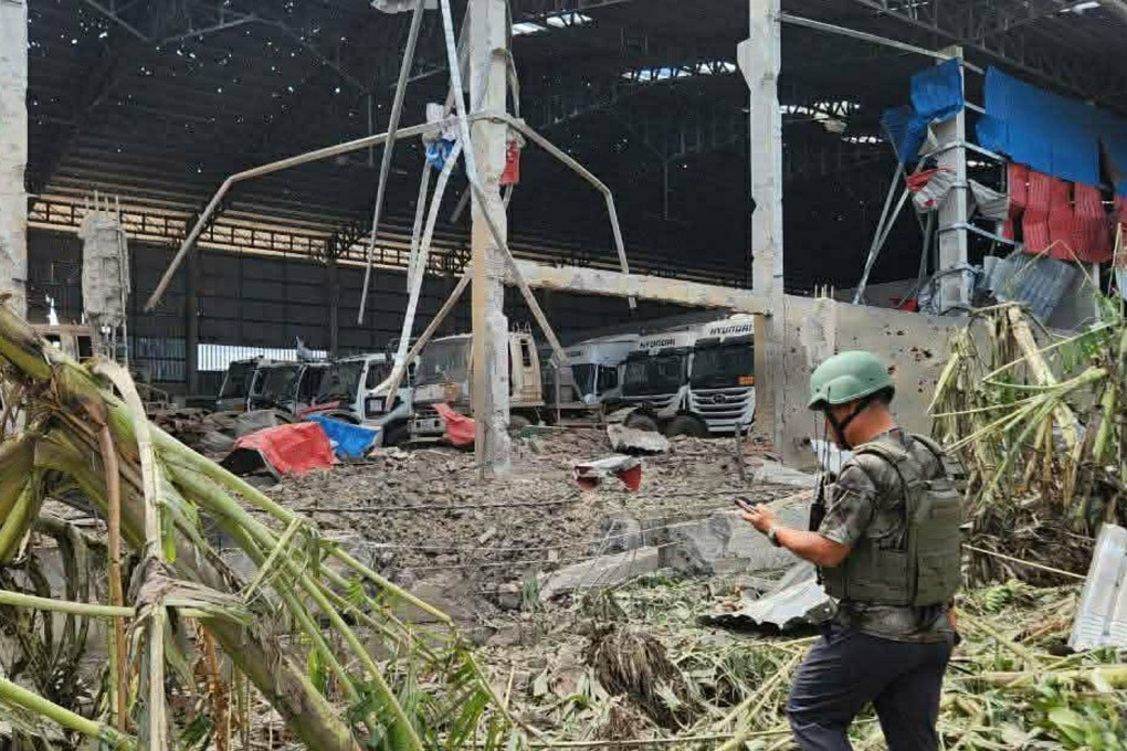 A man inspects a building destroyed by Thai bombing in Poipet town, Banteay Meanchey province, Cambodia, on Thursday. Photo: AKP/AP