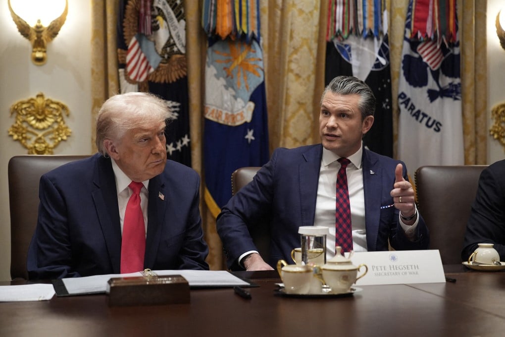 US Secretary of War Pete Hegseth speaks as President Donald Trump listens at a meeting in the White House in Washington on December 2. Photo: CNP/Abaca Press/TNS