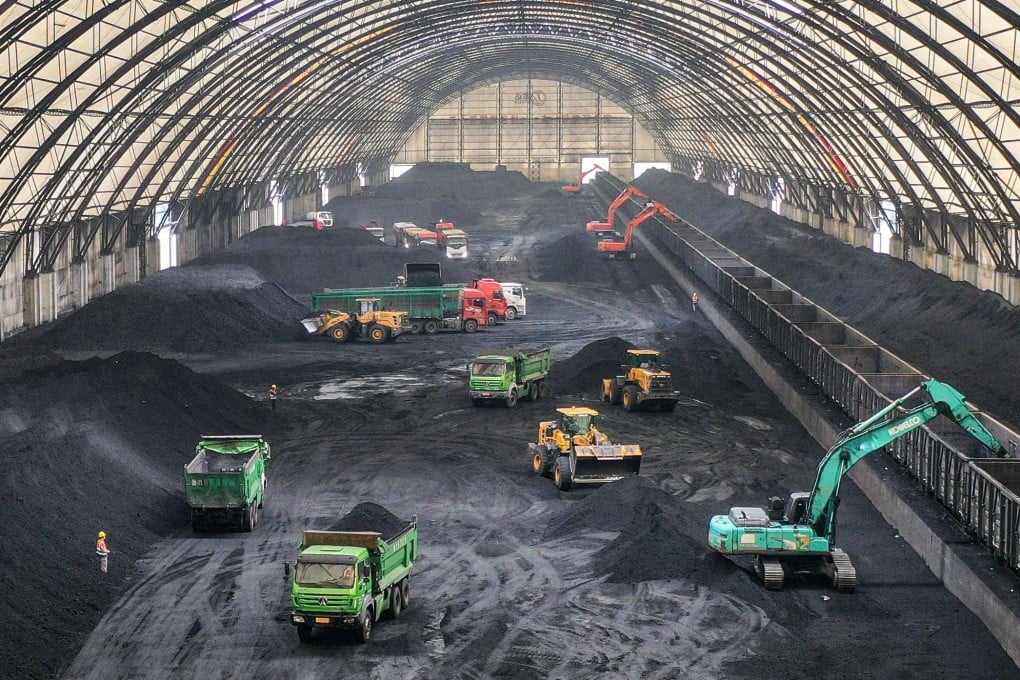 Excavators unload coal in Binzhou, in eastern China’s Shandong province. Photo: AFP