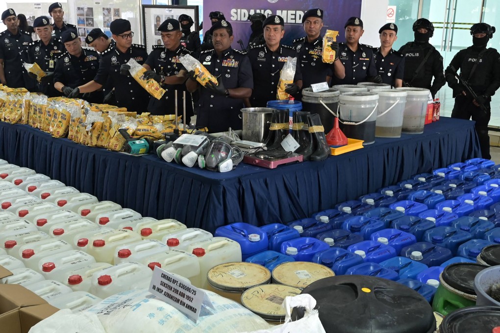 Royal Malaysia Police display seized drugs and manufacturing equipment at a Saturday press conference in Kuala Lumpur. Photo: AFP