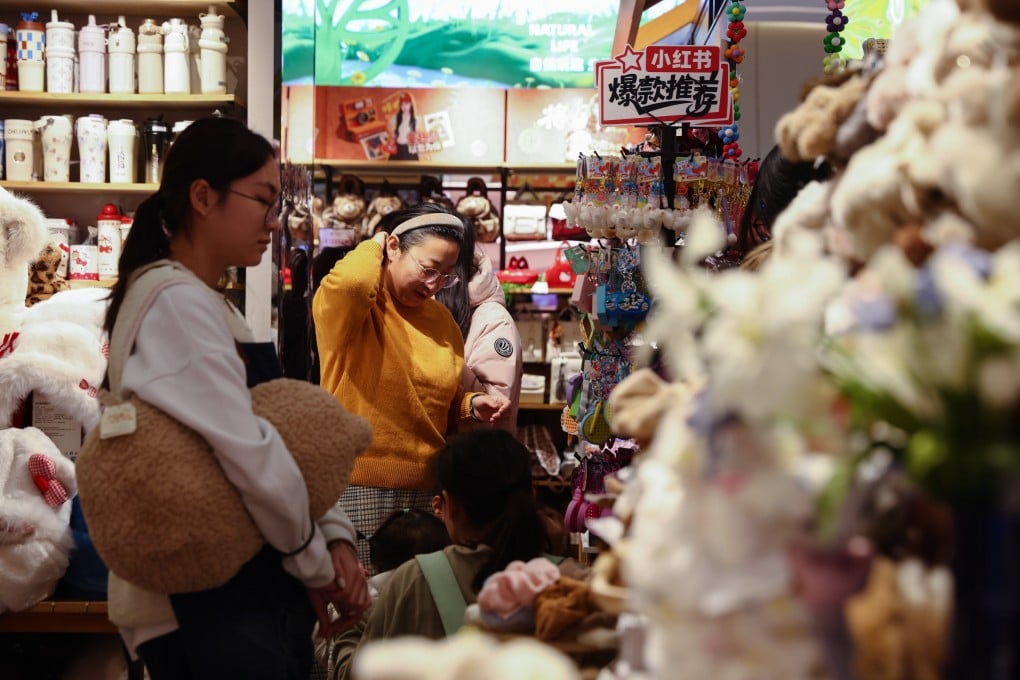 Shoppers browse goods in a gift shop in Beijing, China on December 8. Chinese authorities have highlighted tax policy as a way to support growth amid weak demand. Photo: EPA