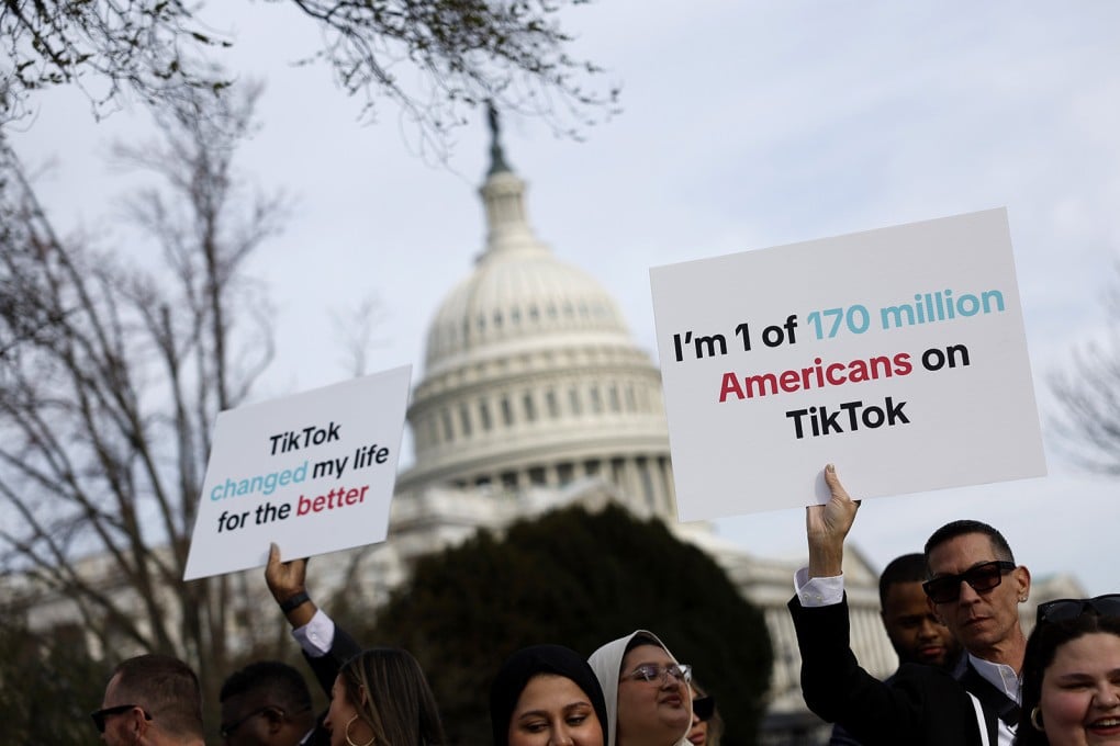 People hold signs in support of TikTok outside the US Capitol Building on March 13, 2024, in Washington. Photo: Getty Images/TNS
