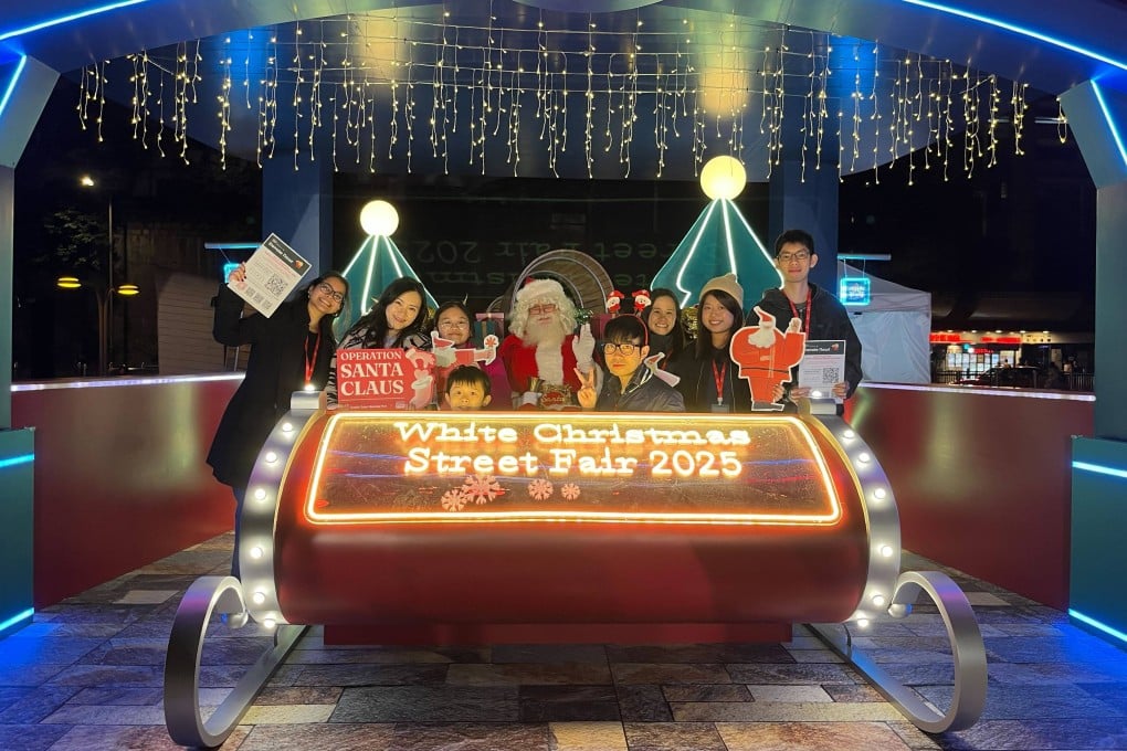 OSC volunteers at Santa’s Neon Studio. Photo: Handout