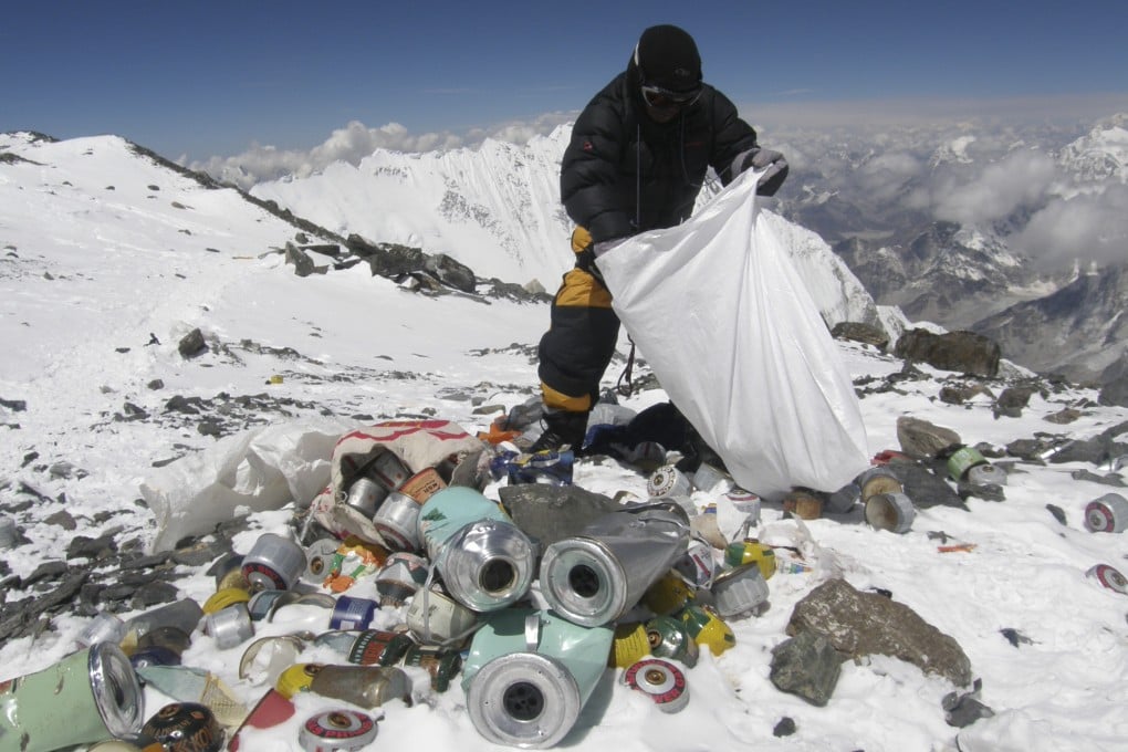 A Nepalese sherpa collecting garbage left by climbers at an altitude of 8,000 metres during the Everest clean-up expedition at Mount Everest in 2010. Photo: AFP